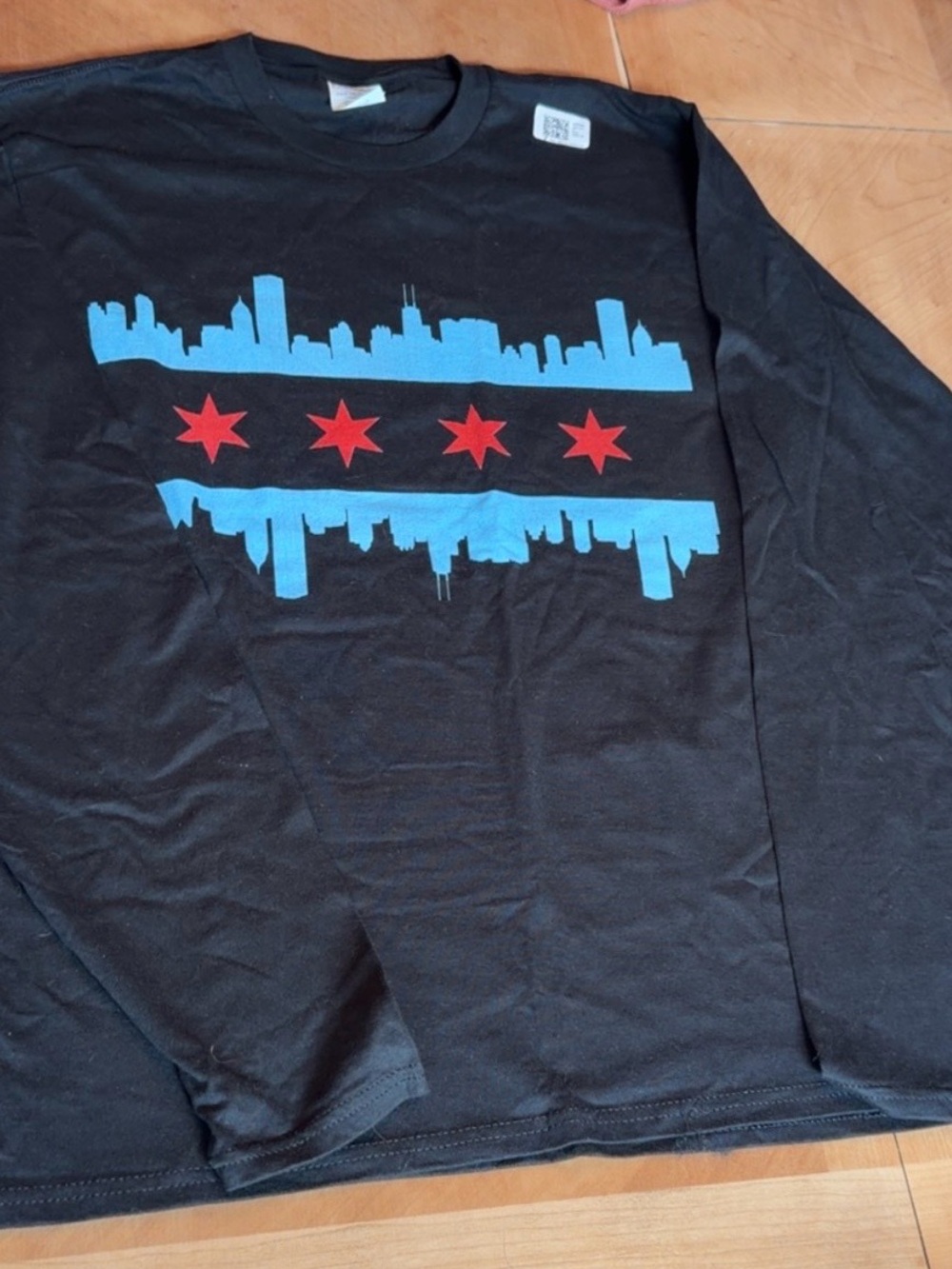 Port and Company Black Long-Sleeve Shirt with Blue City Skyline and Red Stars
